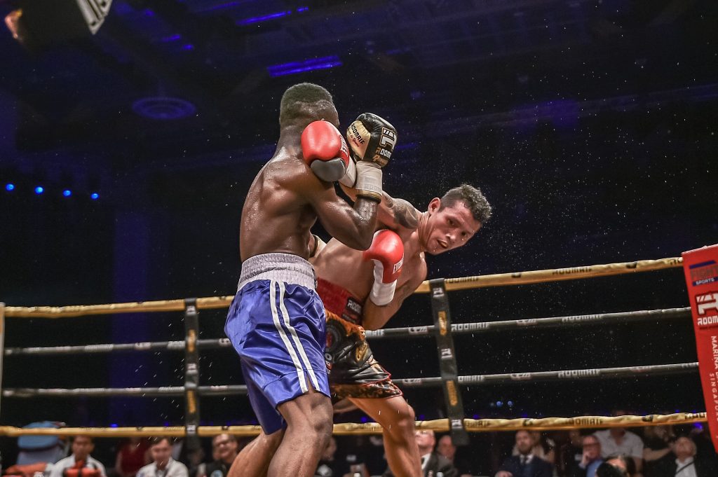 Filipino IBO World Champ Michael “Gloves on Fire” Dasmarinas in action, as he faced his opponent, Ghana’s Manyo “Black Flash” Plange, at Marina Bay Sands, Saturday night.